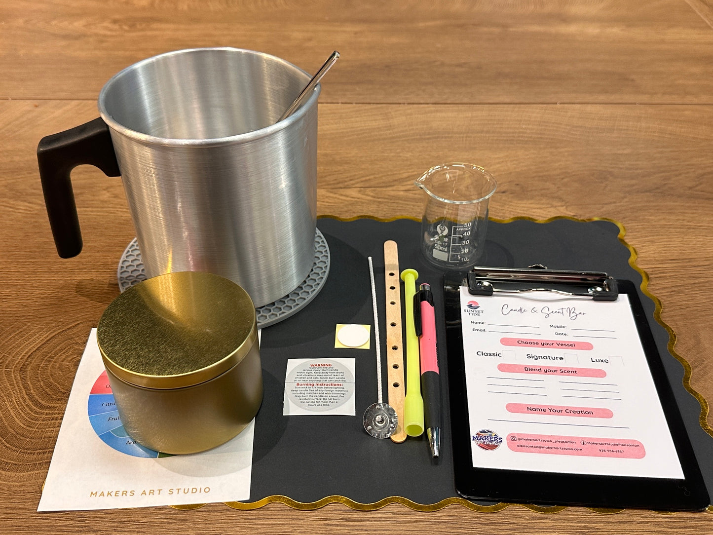 Candle making station with soy wax, fragrance oils and pouring pitcher at Makers Art Studio Pleasanton
