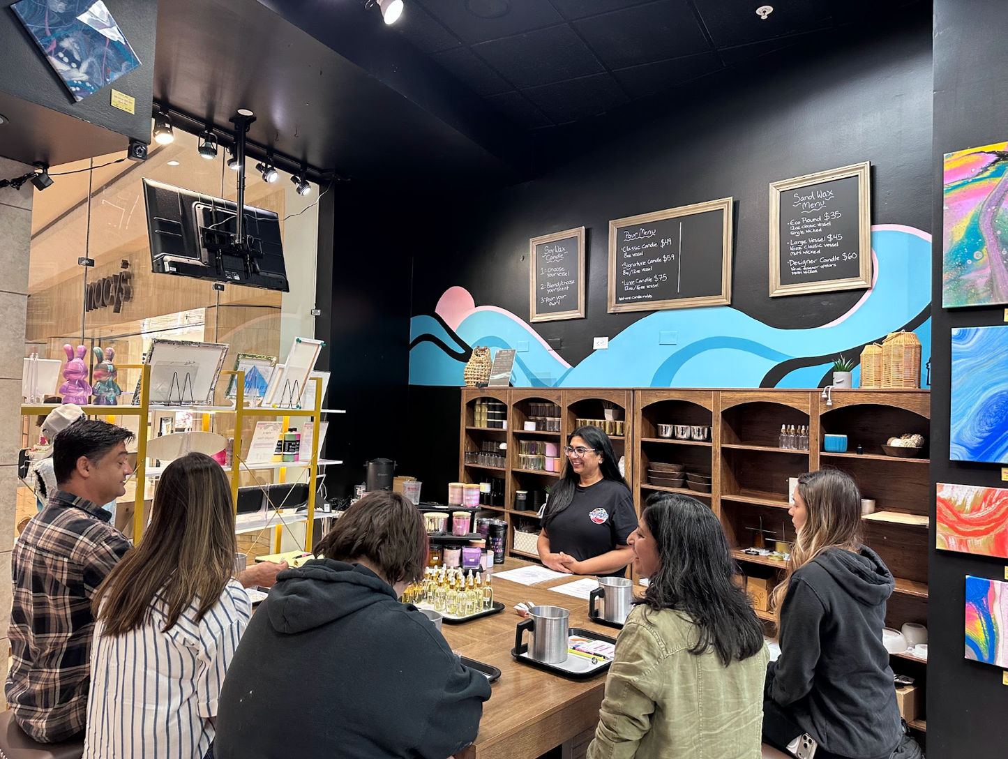 Guests at a candle making class during the Sunset Tide Candle Bar in Pleasanton