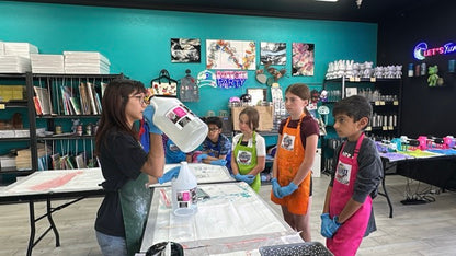 Studio host giving instructions at the start of summer art camp